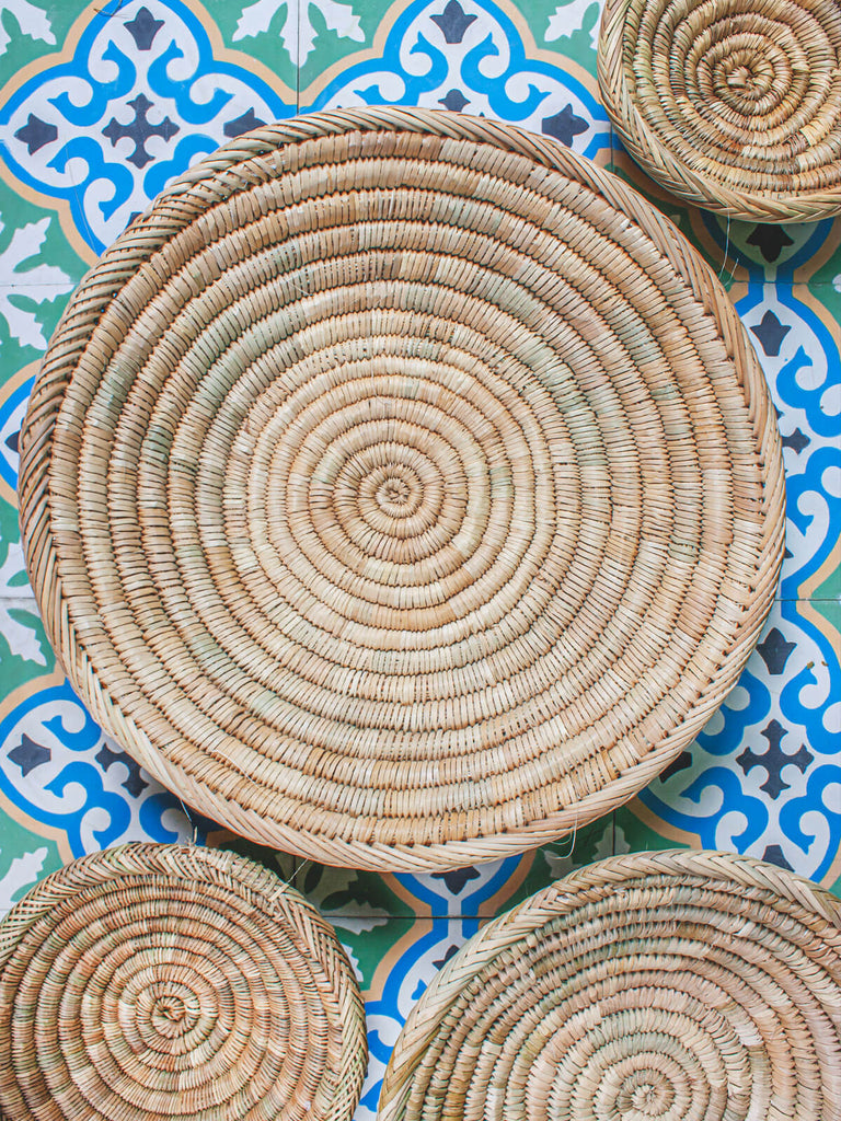 Bohemia Design handmade reed plates on blue and green tiles