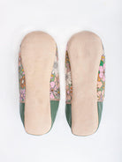 Underside of A pair of Moroccan babouche slippers in an olive and pink floral pattern by Bohemia Design