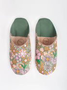 A pair of Moroccan babouche slippers in an olive and pink floral pattern by Bohemia Design