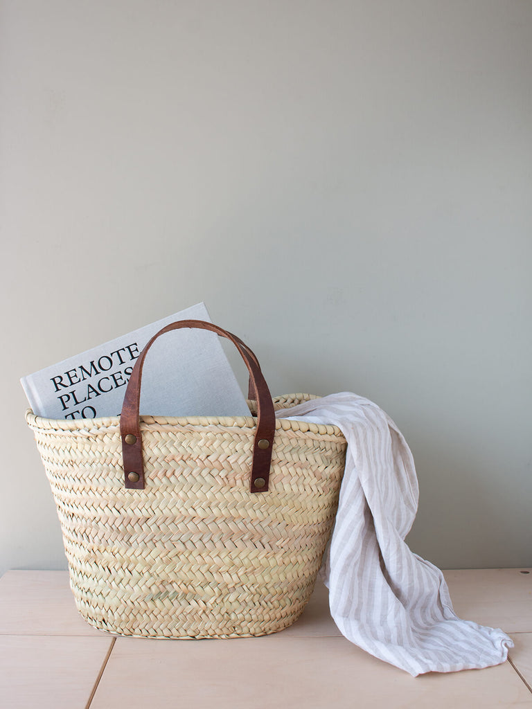 Mini Valencia basket with a book and towel by Bohemia design