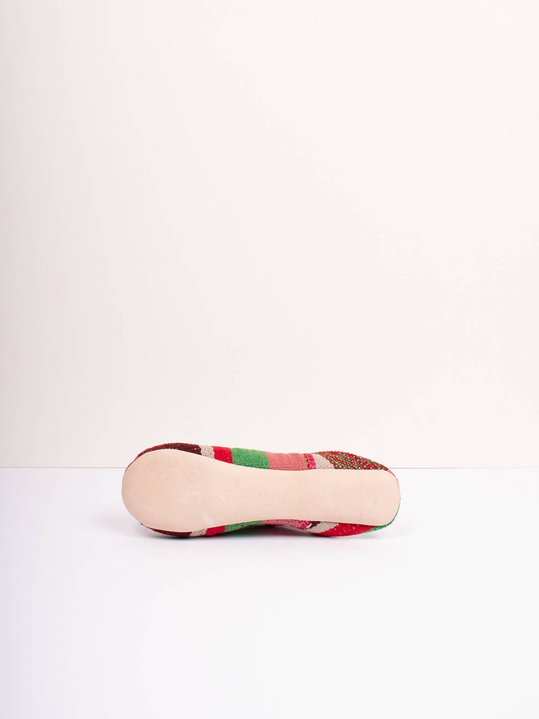 Underside of Moroccan boujad babouche slippers in carnival stripe pattern by Bohemia Design