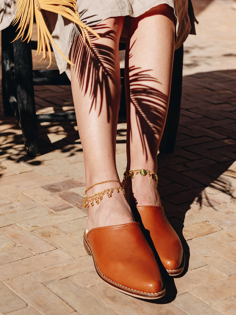Woman wearing Leather tan mules by Bohemia Design