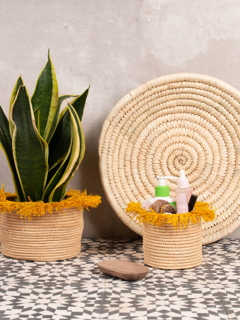 Yellow Raffia Tassel Storage Pots in different sizes used as a planter and storage container