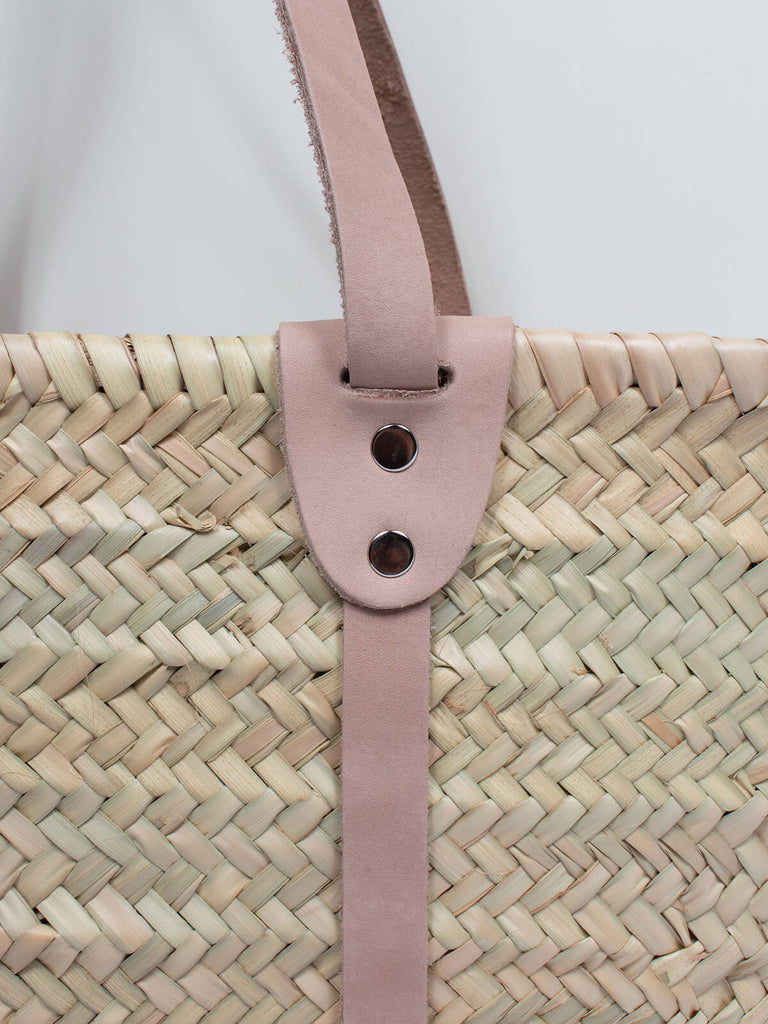 Close up of detail on the leather straps on the Bardot basket bag