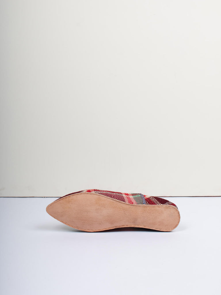 Underside of Moroccan babouche boujad slippers in plum and green check pattern by Bohemia Design