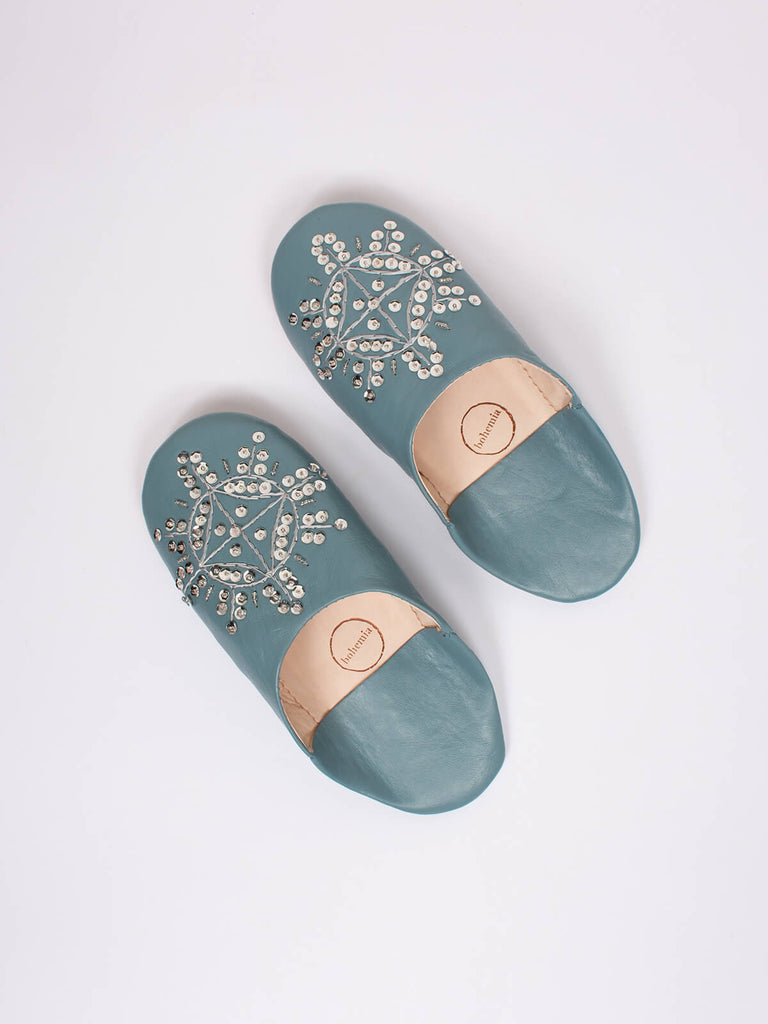 A pair of grey leather Moroccan babouche slippers with a silver sequin design