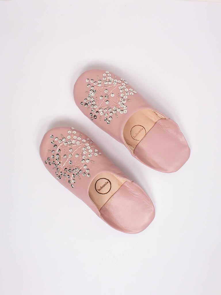 A pair of pink leather Moroccan babouche slippers with a silver sequin design