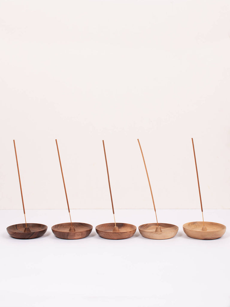 Row of Walnut wood round incense holders by Bohemia Design